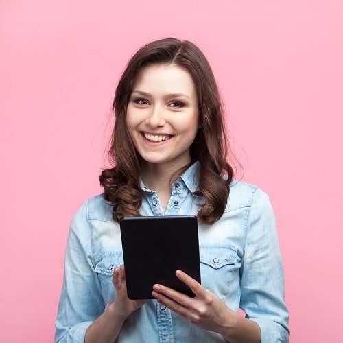 cheerful girl using tablet on pink 2022 11 03 19 12 21 utc min